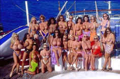 several girls in bikinis on a boat yacht